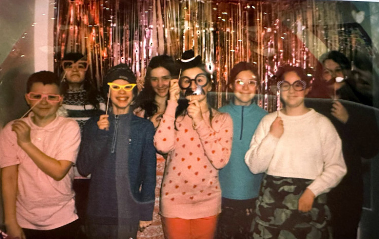 From left: Edgecomb Eddy School sixth graders Carson MacKusick, Olive Tomko, John Cooper, Stella Chapman, Jillian Murray, Margaret McCarthy, Gaby Main, and Katy Pray attend their first fundraising event in October 2022. (Photo courtesy Edgecomb Eddy School)