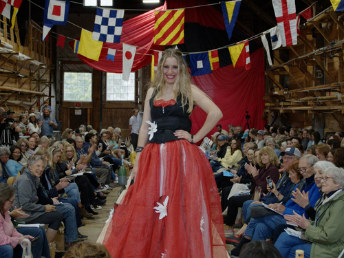 An appreciative audience clapped for FishinÂ’ for Fashion models walking the catwalk at The Shipyard in Boothbay Harbor June 17, showing off creations made from fishing industry materials and gear. (Photo courtesy LCTV)