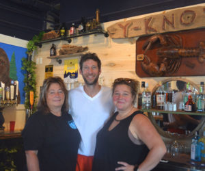 From left: Carol Heaberlin, Nick Heaberlin, and Mindy Jones stand behind the bar at their new restaurant, Y-Knot on the Water Gourmet Eatery, at 85 Parking Lot Lane in downtown Damariscotta. The location was previously the home of Maine Booch and Van Lloyd's Bistro. (Johnathan Riley photo)