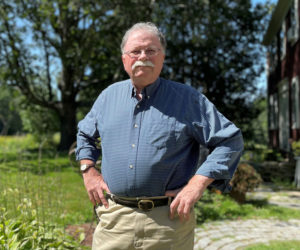 Don Carrigan, written about as one of Maine's most trusted journalists and broadcasters, stands in front of his home in Walpole, where he grew up. Carrigan's 50-year career in Maine news has taken him from Portland to Bangor and everywhere in between. In 2016, Carrigan was inducted into the Maine Association of Broadcasters Hall of Fame. (Johnathan Riley photo)
