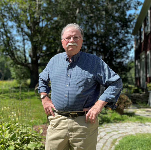 Don Carrigan, written about as one of Maine's most trusted journalists and broadcasters, stands in front of his home in Walpole, where he grew up. Carrigan's 50-year career in Maine news has taken him from Portland to Bangor and everywhere in between. In 2016, Carrigan was inducted into the Maine Association of Broadcasters Hall of Fame. (Johnathan Riley photo)
