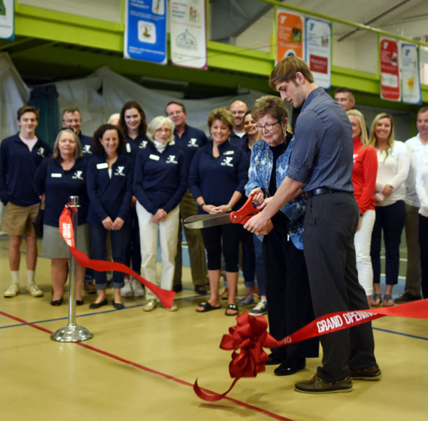 Janice Sprague and her grandson, Nate Masters, cut the ribbon during the grand reopening of the CLC YMCA in Damariscotta on April 29, 2018. Sprague and her late husband, Neil, founded the recreation center that preceded the CLC YMCA. (LCN file photo)
