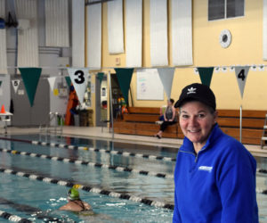 Lori LaPointe stands at the Wiscasset Community Center pool in February, several months before her retirement as aquatics director on Wednesday, July 26. She has spent her life swimming, close to 25 years of it at the Wiscasset pool, and said she has enjoyed teaching life skills, seeing all ages enjoy the water, and working with her team of coworkers. (Elizabeth Walztoni photo)