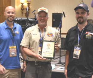 Charles Harris (middle) and Phillip Reinhardt (left) receive the first place plaque for winning the one day Sportsman Division Trophy Run Rally in Florida, a precursor to the nine day Hemmings Motor News Great Race. (Courtesy photo)
