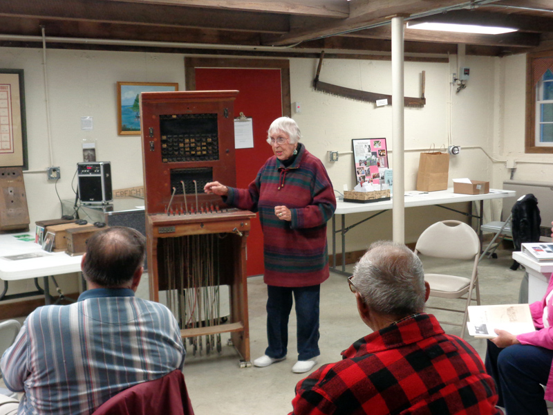 May Davidson captivates an audience talking about the old telephone switchboard in the basement of the old Jefferson town house, remembering her experiences working for the Nash Telephone Co. during a presentation. The switchboard and old telephones are on display at the historical society's open houses this summer. (Courtesy photo)