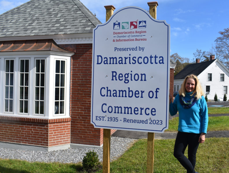 Lisa Hagen, executive director of the Damariscotta Region Chamber of Commerce and Information Bureau, stands outside the chamber's recently renovated and reopened building in downtown Damariscotta on Monday, Oct. 9. Hagen, who will leave the post at the end of the year, said she stayed with the role to see the project to completion through red tape delays. (Elizabeth Walztoni photo)