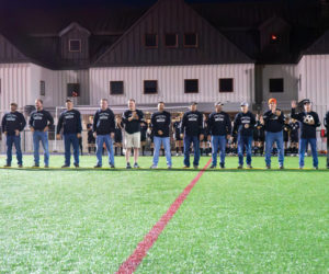 Members of Lincoln Academy's 1987 state champion boys soccer team receive recognition before the school's homecoming game against Medomak Valley on Saturday, Sept. 23. (Photo courtesy Lincoln Academy)