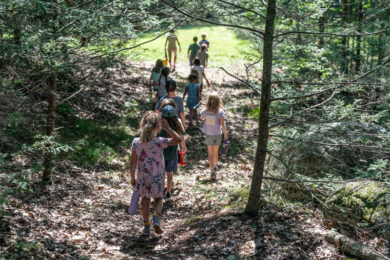 Brightfield students hit the trail in the woods near their Bath school. The place-based education school serves students from Bristol, Newcastle, Wiscasset, Alna, Westport Island, and Edgecomb, and well as students from Sagadahoc and Cumberland counties. (Photo courtesy Kate Hitchings Aholt)