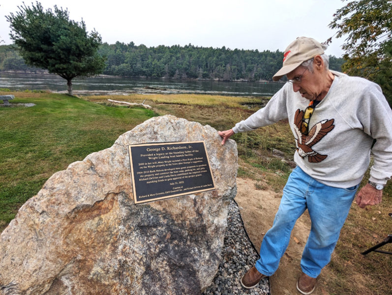 Former Westport Island Select Board member George Richardson Jr. reads the plaque unveiled at Wright Landing on Saturday, Sept. 30. The plaque names Richardson as the founding father of Wright Landing, the town's public boat launch. (Photo courtesy Gaye Wagner)