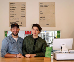 Jonathan Turcotte and Kelsey Grossmann stand behind the counter of their new business, Yonder, at 100 Main St. in Wiscasset. Sandwiches, soups, and salads make up the menu of Yonder. (Piper Pavelich photo)