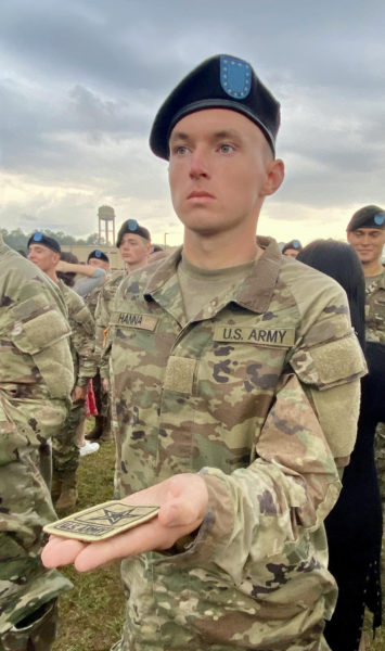 Pfc. Zachary Hanna receives his Army patch from his mother, Linda Bishop, in a Turning Green Ceremony at Fort Moore, Ga. on Friday, Oct. 20. (Courtesy photo)