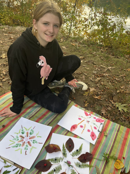 A camper creates an array of mandalas inspired by her woodland setting. (Photo courtesy Hearty Roots)