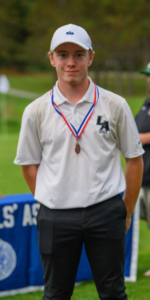 Kellen Adickes wears his third place medal at the Maine Class B championship. (Courtesy photo)