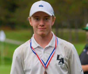 Kellen Adickes wears his third place medal at the Maine Class B championship. (Courtesy photo)