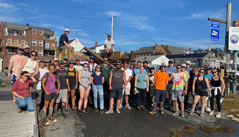 Staff and volunteers from over a dozen local businesses and organizations participating in the annual Damariscotta River cleanup effort stand in front of the truckload of trash they collected from the riverÂ’s shoreline on Oct. 3. (Photo courtesy Coastal Rivers Conservation Trust)