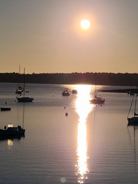 Filtered smokey sunlight over the harbor in Round Pond (Photo courtesy Lori Crook)