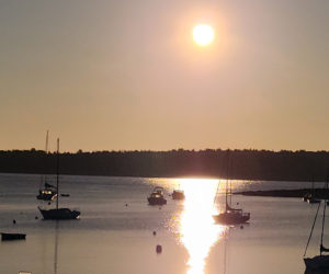 Filtered smokey sunlight over the harbor in Round Pond (Photo courtesy Lori Crook)