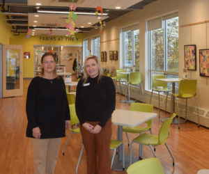 Lincoln County Administrator Carrie Kipfer (left) and Central Lincoln County YMCA CEO Casey Clark Kelley stand in the lobby of the Y in Damariscotta. The two organizations are partnering to bring the CLC Y's successful community navigator program to all of Lincoln County. (Molly Rains photo)