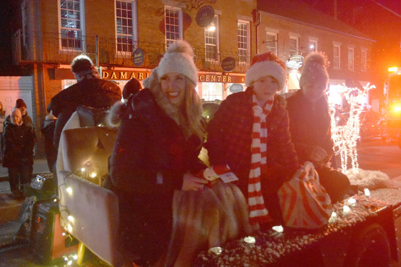 Riders on the B&Co. float prepare to pass out gifts to attendees of the Villages of Light parade in Damariscotta on Saturday, Nov. 25. (Maia Zewert photo)