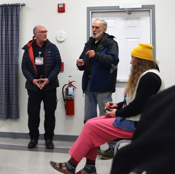 From left: Delta Quality Control Manager Chip Getchell and Coopers Mills Fire Department Association member Chuck Vaughan discuss the idea of the ambulance service setting up a satellite location in the fire department's building as Whitefield Planning Board member Robin Huntley looks on during the Whitefield Select Board meeting on Tuesday, Nov. 21. (Piper Pavelich photo)