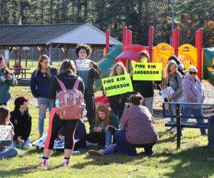 Wiscasset Middle High School students gather outside of the superintendent's office located at 225 Gardiner Road in Wiscasset on Monday, Nov. 20. Students walked out of WMHS at 11:05 a.m. to show support for Principal Gina Stevens, who is currently on administrative leave. (Piper Pavelich photo)