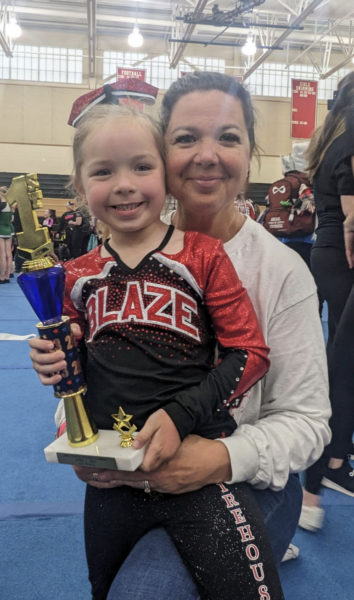 Brie McCarthy, pictured with her daughter, Fiona, has been named Nfinity Cheer Coach of the Year. (Courtesy photo)