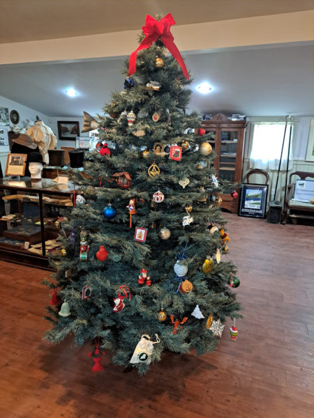 The Christmas tree at the Waldoborough Historical Society museum with the ornaments that have been placed on it through the years. (Photo courtesy Waldoborough Historical Society)