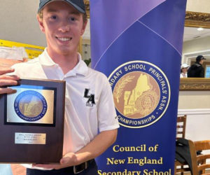 Lincoln Academy golfer Kellen Adickes holds his New England boys golf championship plaque. (Photo courtesy Samantha Adickes)