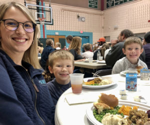 Family members of Nobleboro Central School students in grades K-4 enjoy meals of turkey and all the fixings in the NCS gym on Nov. 17. (Photo courtesy Nobleboro Central School)