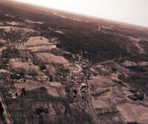 This picture shows the path of the fire in the vast unbroken space between River Road and the former Hopkins Hill Road. The uncontrolled fire raced toward Academy Hill Road, near the center of the picture, threatening the businesses and the houses there. The help provided by additional manpower proved vital, like the boys from Lincoln Academy who walked into areas where the fire trucks could not drive. (Photo courtesy Newcastle Historical Society Museum)