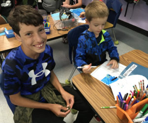 Teens work with younger students doing writing assignments, taking field trips, reading aloud and more with the "buddies" program at Nobleboro Central School. (Photo courtesy Nobleboro Central School)
