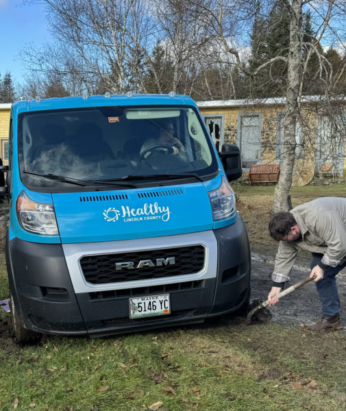 The Healthy Lincoln County crew participated in a surprise team-building exercise after the Bringing Food Home van got stuck in a muddy driveway. (Photo courtesy Michaela Stone)