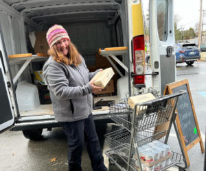 Michaela Stone receives donations at Rising Tide Co-op in Damariscotta on Giving Tuesday. (Photo courtesy Healthy Lincoln County)