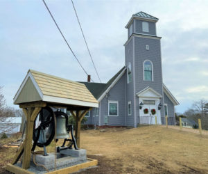 The New Harbor United Methodist Church on Thursday, Jan. 4 with its new bell tower constructed in a traditional Methodist style. The original bell, removed in 2016, sits in the front lawn of the church. (Johnathan Riley photo)
