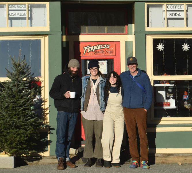 From left: Jon Merry, Ramsea Lucas, Alexandra Welch, and Derek Degeer stand outside S. Fernald's Country Store in Damariscotta, the business they plan to buy together after 18 months on the market with the help of a crowdfunding campaign. The four locals were connected by "kismet, fate, and destiny" to make the purchase happen, they said. (Elizabeth Walztoni photo)