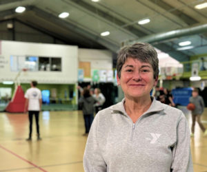 Robin Maginn, of Bristol, stands along the basketball courts in the CLC YMCA in Damariscotta, where she's been a fitness instructor and personal trainer for over 20 years. Maginn, who at one point was the fitness director of the Y, enjoys movement almost as much as she does music and the outdoors. (Johnathan Riley photo)
