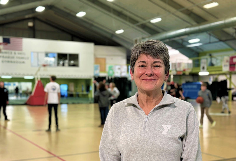 Robin Maginn, of Bristol, stands along the basketball courts in the CLC YMCA in Damariscotta, where she's been a fitness instructor and personal trainer for over 20 years. Maginn, who at one point was the fitness director of the Y, enjoys movement almost as much as she does music and the outdoors. (Johnathan Riley photo)