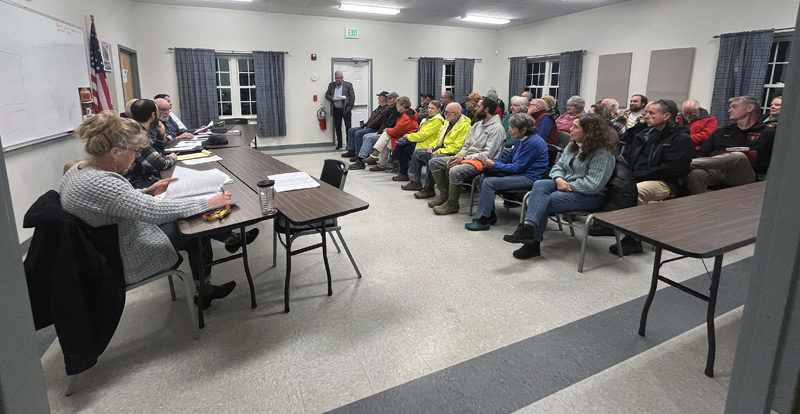 Coopers Mills Volunteer Fire Department Association President Brian Huntley (center) addresses the Whitefield Select Board at a special meeting the evening of Thursday, Dec. 28 at the Whitefield fire station. (Piper Pavelich photo)