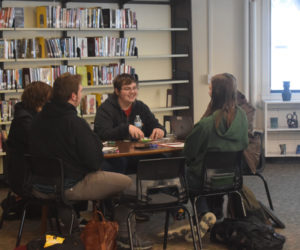 Wiscasset Middle High School junior Landan Gay (center) laughs with other high school members of the school's Dungeons & Dragons Club on Jan. 8. Students said that the humor of the game was one of the reasons they loved to play. (Molly Rains photo)