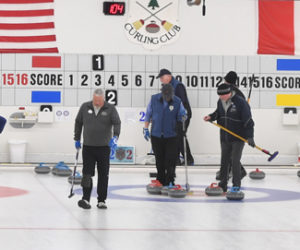 Damariscotta resident Andy Gross (left) plays on one of three curling matches at the Belfast Curling Club. (Mic LeBel photo)