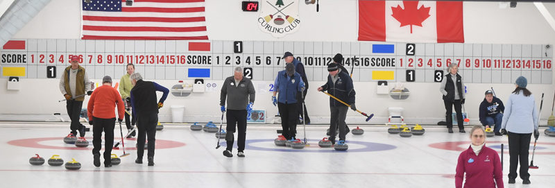 Damariscotta resident Andy Gross (left) plays on one of three curling matches at the Belfast Curling Club. (Mic LeBel photo)