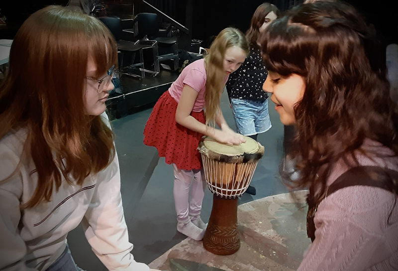 LA junior Sophia Scott teaches basic drumming rhythms to students performing in Heartwood's "The Jungle Book" production Friday, Jan 26, and Saturday, Jan. 27. (Photo courtesy Heartwood Theater)