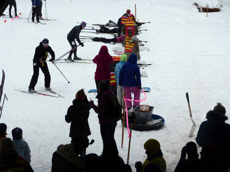 Biathlon competitors transition from skiing to the target range. (Photo courtesy Midcoast Conservancy)