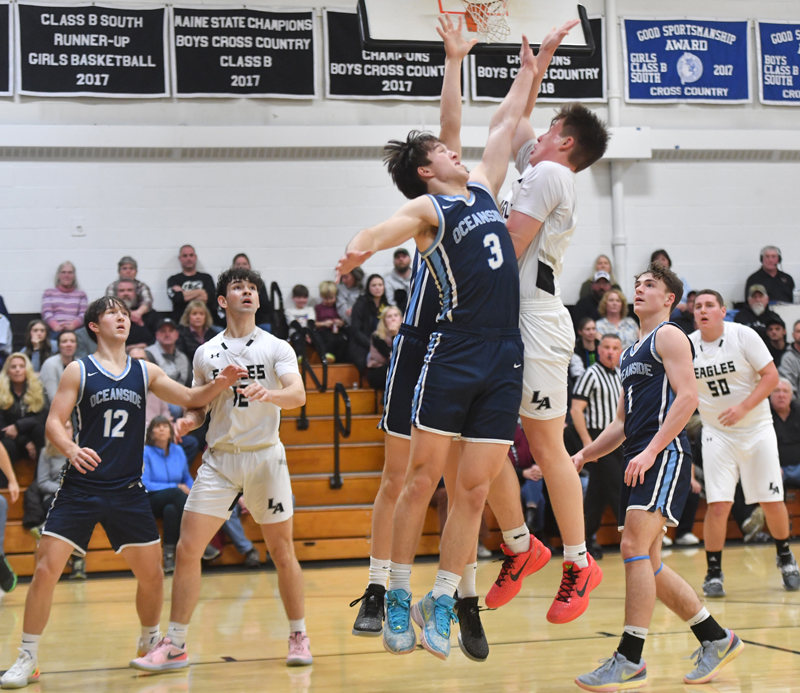 Eagle Gabe Hagar gets fouled by OceansideÂ’s Carter Galley. (Mic LeBel photo)