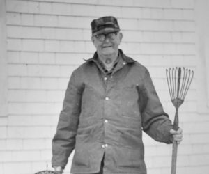 Harold Coombs of Belvedere Road holds the five-pronged eel spear used in 1879 by his uncle, William Coombs. Also shown is an eel trap formerly used during the summer by Wilbert J. Plummer, father of Mrs. Harold Coombs. (Photo courtesy Nobleboro Historical Society)