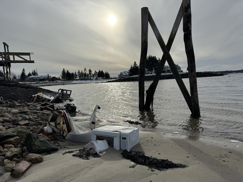 Along the shore adjacent to Little Beach in Pemaquid sits what remains of the McLain familyÂ’s longtime dock and cottage that was destroyed in the Jan. 10 storm. The McLain familyÂ’s story is one of many similar stories coming out of Lincoln County as residents grapple with damage in the wake of the storms. See related story on page 13. (Johnathan Riley photo)