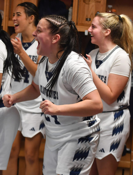 Maddy York celebrates the arrival of head coach Katie Stannard to the locker room after a dramatic comeback win in overtime. (Mic LeBel photo)