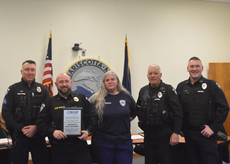 From left: Damariscotta Police Department Sgt. Erick Halpin, Chief Jason Warlick, Administrative Assistant Joanna Kenefick, Officer Tyson Fait, and Officer Phil Tessier receive a plaque for the department's new state accreditation on Wednesday, Feb. 21. (Elizabeth Walztoni photo)