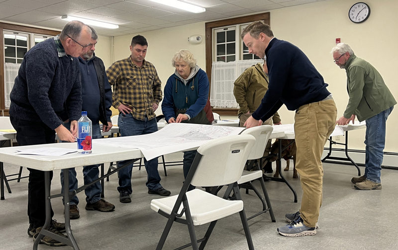 Red Sky Capital Partners LLC representative James "Wylie" Johnston, (front right) presents the company's plan to expand upon 41 existing lots at Indian Run Estates Mobile Home Park to the Dresden Planning Board Wednesday, Feb. 14. Johnston told the board the company requested approval for 20 additional lots in an application to the Maine Department of Environmental Protection. (Piper Pavelich photo)