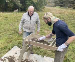 Waldoboro resident and historian Michael Amico (right) sifts through soil removed from his property in fall 2023 while archaeologist Harbour Mitchell looks on. "Waldoboro could become a go-to place for science," Mitchell said on Jan. 28. (Photo courtesy Michael Amico)